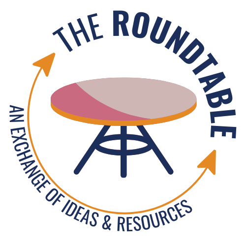 Navy blue and magenta image of a table with text that reads "The Roundtable" at the top, and "An exchange of ideas & resources" at the bottom.